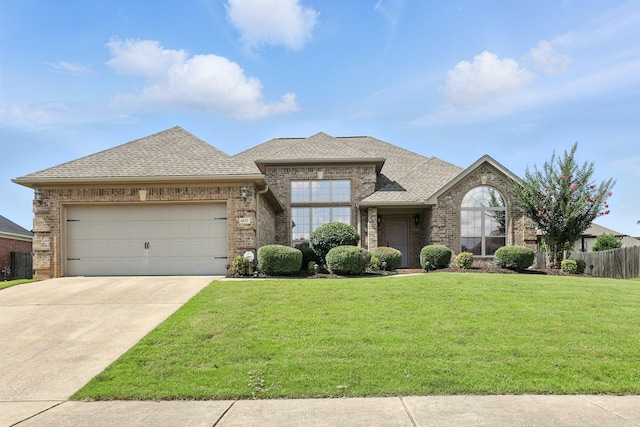 6137 Remington Dr, Bryant, AR 72022 - view of front of home featuring brick siding, a garage, roof with shingles, and concrete driveway