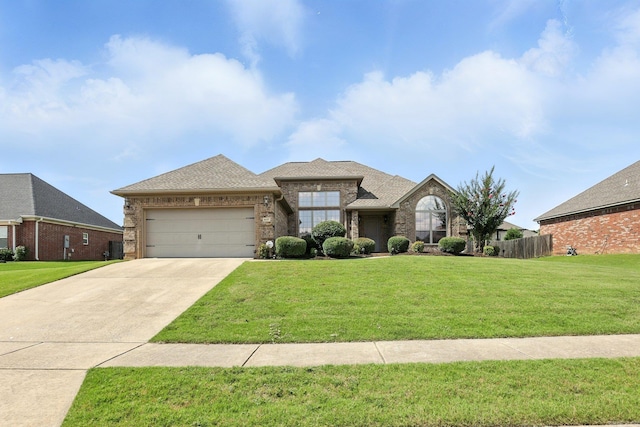 6137 Remington Dr, Bryant, AR 72022 - view of front of property featuring a garage, brick siding, concrete driveway, and roof with shingles