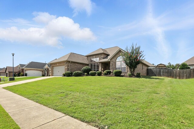 6137 Remington Dr, Bryant, AR 72022 - view of front of property featuring brick siding, a garage, and concrete driveway