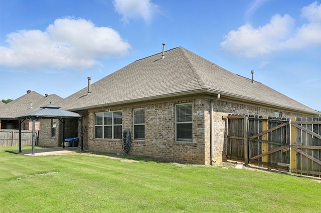6137 Remington Dr, Bryant, AR 72022 - back of house featuring a gazebo, a patio, brick siding, and roof with shingles