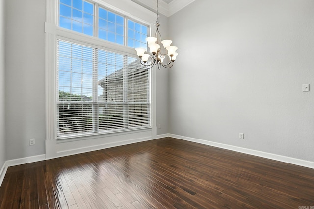 6137 Remington Dr, Bryant, AR 72022 - spare room with a chandelier, plenty of natural light, dark wood-style floors, and crown molding