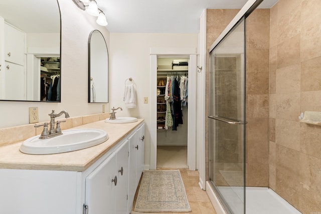 120 Crystal Ct, Little Rock, AR 72205 - full bathroom with double vanity, a walk in closet, and a shower stall