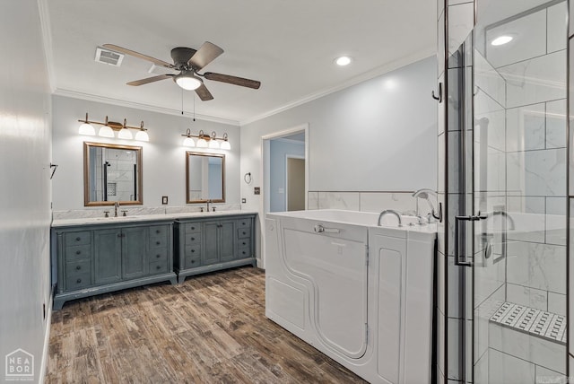 5510 Crowleys Ridge Rd, Jonesboro, AR 72404 - full bath featuring a ceiling fan, double vanity, a stall shower, ornamental molding, and wood finished floors
