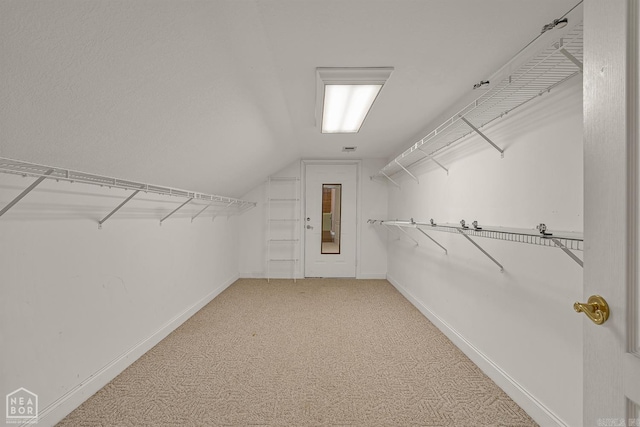 5510 Crowleys Ridge Rd, Jonesboro, AR 72404 - walk in closet featuring carpet floors and vaulted ceiling