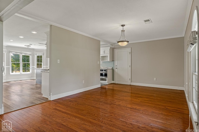 5510 Crowleys Ridge Rd, Jonesboro, AR 72404 - unfurnished living room with crown molding, wood finished floors, recessed lighting, and a ceiling fan