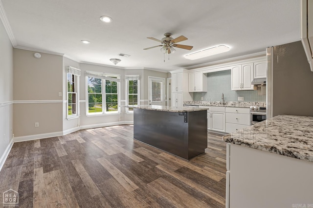 5510 Crowleys Ridge Rd, Jonesboro, AR 72404 - kitchen with a ceiling fan, white cabinetry, dark wood-style floors, ornamental molding, and recessed lighting