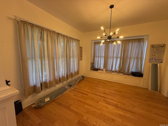 3000 S Cherry St, Pine Bluff, AR 71603 - unfurnished room featuring a chandelier and light wood-style floors