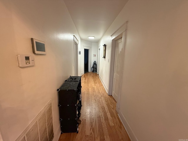 3000 S Cherry St, Pine Bluff, AR 71603 - hall featuring light wood-style flooring and baseboards