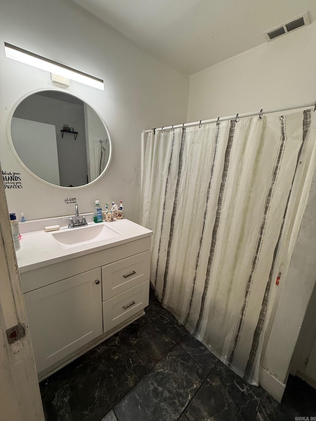3000 S Cherry St, Pine Bluff, AR 71603 - bathroom with marble finish floors and vanity