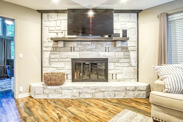 23 Emanuel Dr, Hot Springs Village, AR 71909 - living area featuring a stone fireplace and wood finished floors