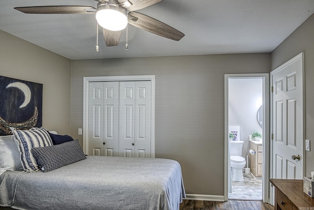 23 Emanuel Dr, Hot Springs Village, AR 71909 - bedroom with dark wood-type flooring, a closet, a ceiling fan, and connected bathroom