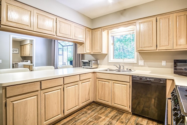 23 Emanuel Dr, Hot Springs Village, AR 71909 - kitchen with black dishwasher, washing machine and clothes dryer, light brown cabinets, a peninsula, and light countertops