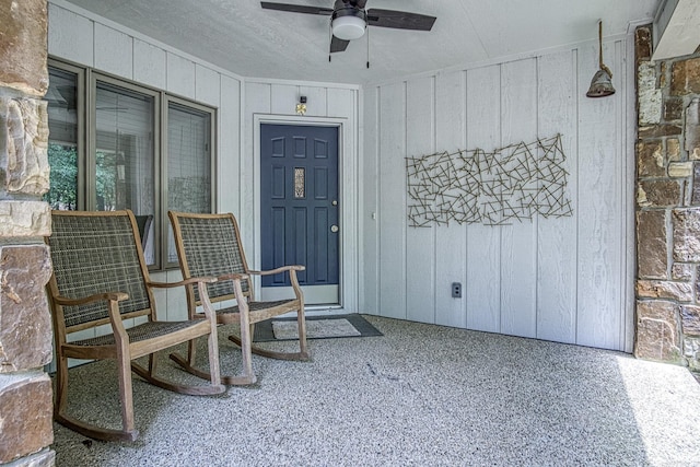 23 Emanuel Dr, Hot Springs Village, AR 71909 - entrance to property with a ceiling fan and board and batten siding
