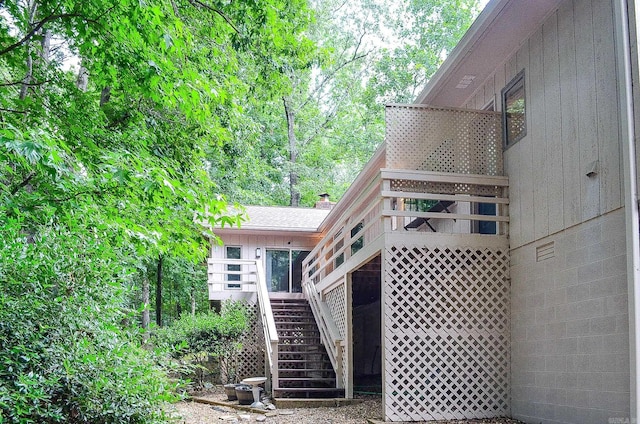 23 Emanuel Dr, Hot Springs Village, AR 71909 - back of property featuring stairs and a wooden deck