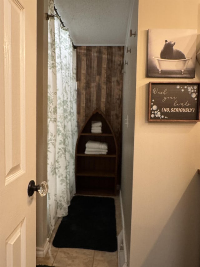 bathroom featuring tile patterned floors and curtained shower