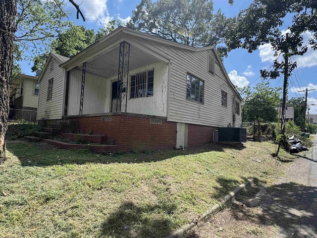 600 S Maple St, Little Rock, AR 72205 - view of property exterior with a central AC unit and a lawn
