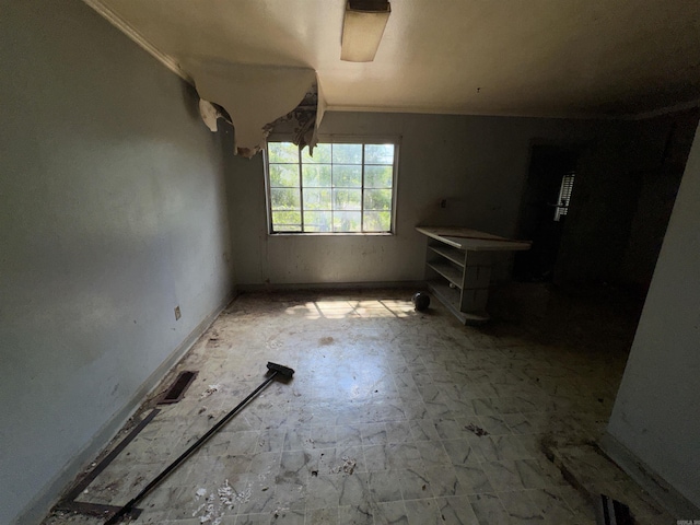 600 S Maple St, Little Rock, AR 72205 - unfurnished dining area featuring crown molding and baseboards