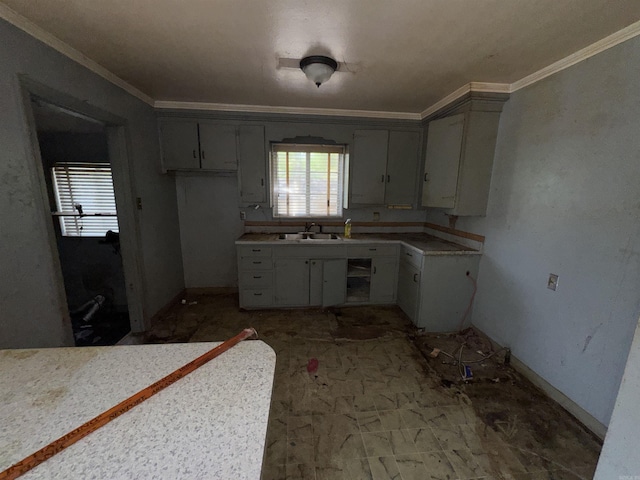 600 S Maple St, Little Rock, AR 72205 - kitchen with healthy amount of natural light, ornamental molding, and light countertops