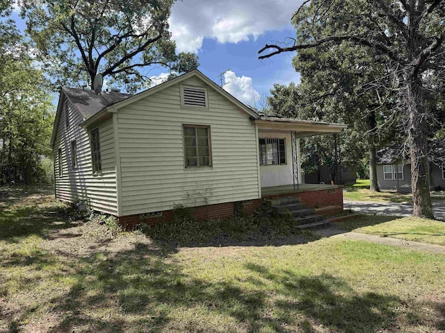 600 S Maple St, Little Rock, AR 72205 - view of home's exterior with a lawn, covered porch, and crawl space