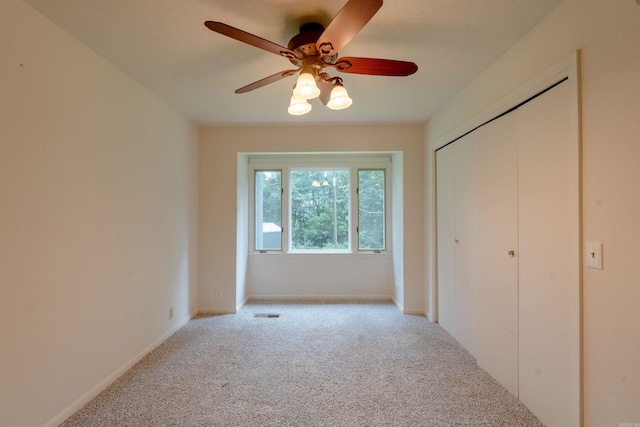 2128 Yamania Way, Heber Springs, AR 72543 - unfurnished bedroom featuring carpet flooring, a closet, and a ceiling fan
