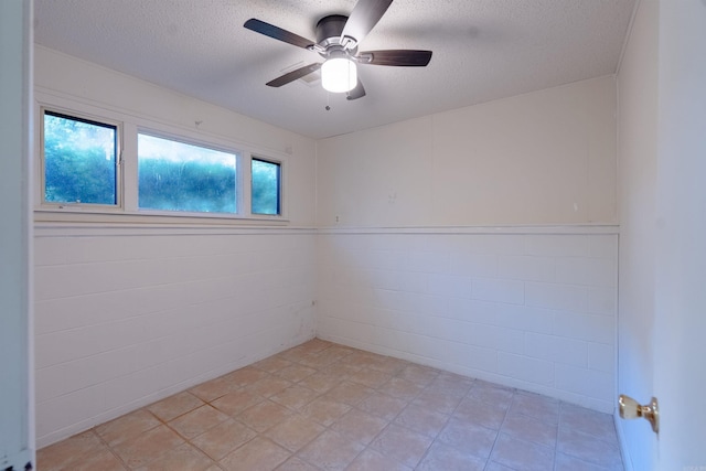 2128 Yamania Way, Heber Springs, AR 72543 - spare room with a textured ceiling and a ceiling fan