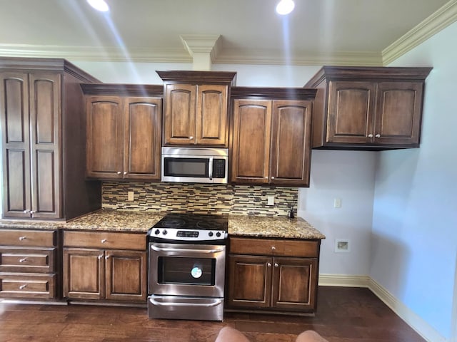 140 Bentley Cir, Little Rock, AR 72210 - kitchen featuring appliances with stainless steel finishes, light stone countertops, tasteful backsplash, dark wood finished floors, and crown molding