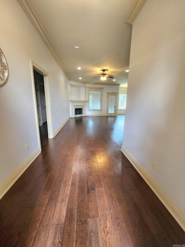 140 Bentley Cir, Little Rock, AR 72210 - unfurnished living room with crown molding, dark wood-style floors, ceiling fan, a fireplace, and recessed lighting