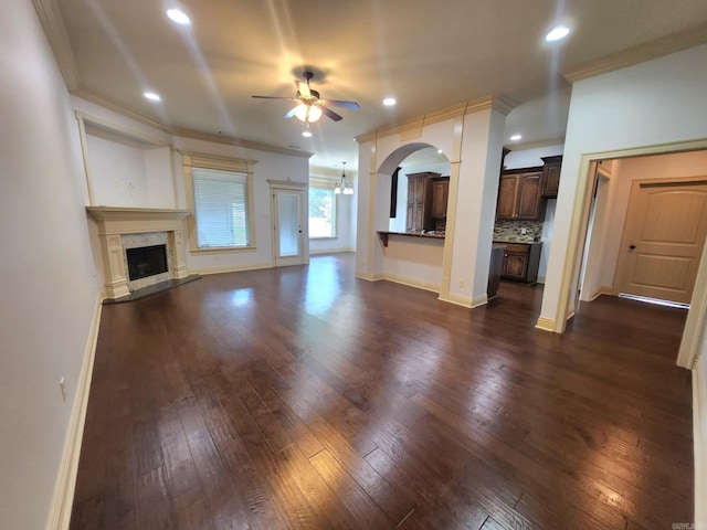 140 Bentley Cir, Little Rock, AR 72210 - unfurnished living room featuring ceiling fan, crown molding, dark wood-style floors, recessed lighting, and a fireplace