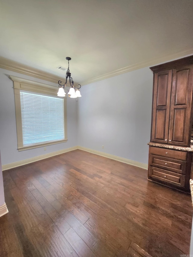 140 Bentley Cir, Little Rock, AR 72210 - spare room with a chandelier, crown molding, and dark wood-type flooring