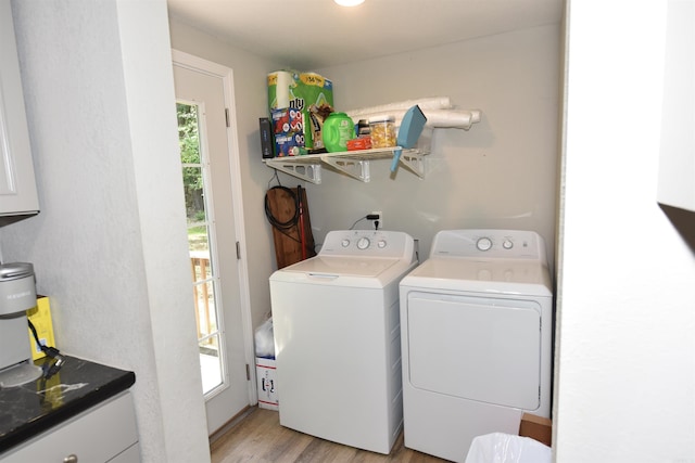 242 Lakeview Dr, Fairfield Bay, AR 72088 - laundry area featuring washing machine and dryer and light wood finished floors