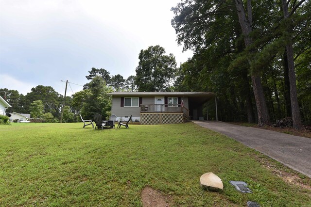 242 Lakeview Dr, Fairfield Bay, AR 72088 - ranch-style house featuring driveway, a front lawn, and an attached carport