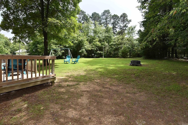 242 Lakeview Dr, Fairfield Bay, AR 72088 - view of grassy yard with an outdoor fire pit