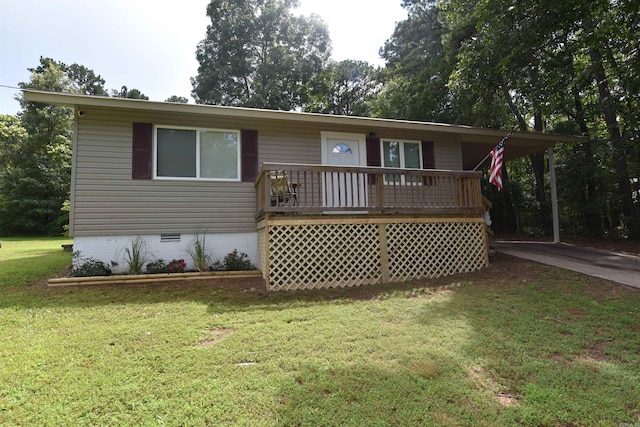 242 Lakeview Dr, Fairfield Bay, AR 72088 - view of front facade featuring crawl space, a front lawn, concrete driveway, covered porch, and a carport