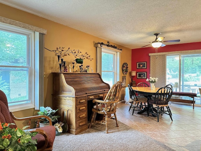 67 Powhatan Dr, Cherokee Village, AR 72529 - dining room featuring a textured ceiling, a ceiling fan, and light tile patterned floors