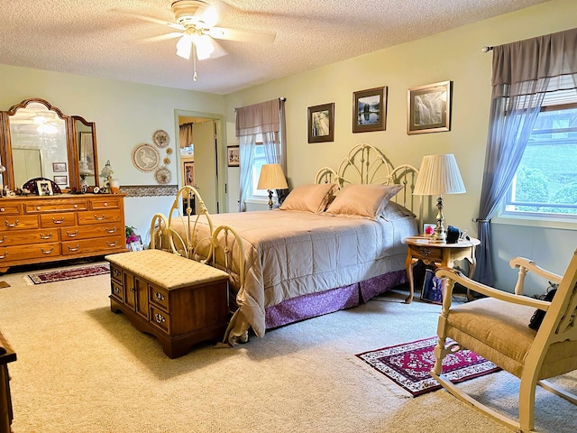 67 Powhatan Dr, Cherokee Village, AR 72529 - carpeted bedroom with a textured ceiling and ceiling fan