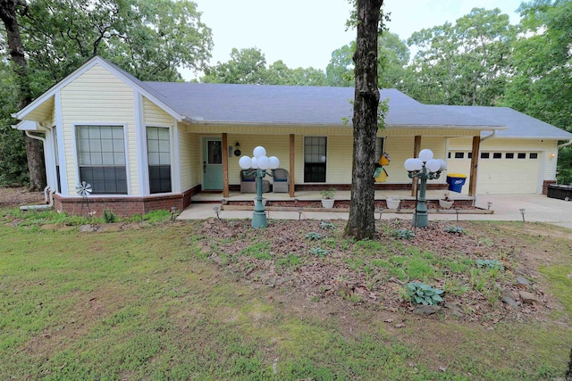 34 Ridge Rd, Cabot, AR 72023 - single story home featuring a garage, covered porch, concrete driveway, and a front yard