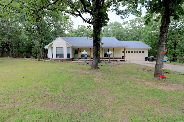 34 Ridge Rd, Cabot, AR 72023 - ranch-style house featuring a front lawn, an attached garage, driveway, and covered porch