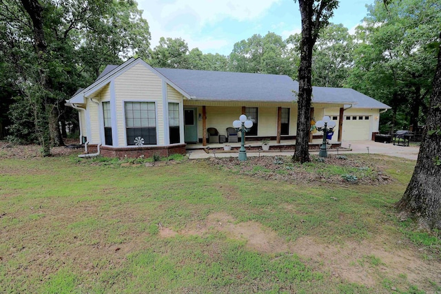 34 Ridge Rd, Cabot, AR 72023 - ranch-style home featuring a garage, covered porch, a front lawn, and concrete driveway