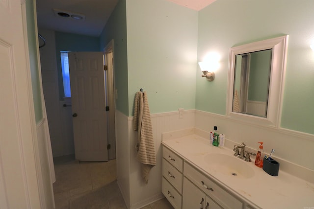 34 Ridge Rd, Cabot, AR 72023 - bathroom with vanity, wainscoting, and tile patterned floors
