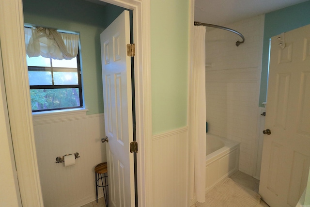 34 Ridge Rd, Cabot, AR 72023 - full bath with a wainscoted wall, shower / bath combination with curtain, and tile patterned floors