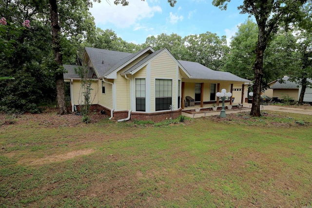 34 Ridge Rd, Cabot, AR 72023 - rear view of property with a garage, a yard, and concrete driveway