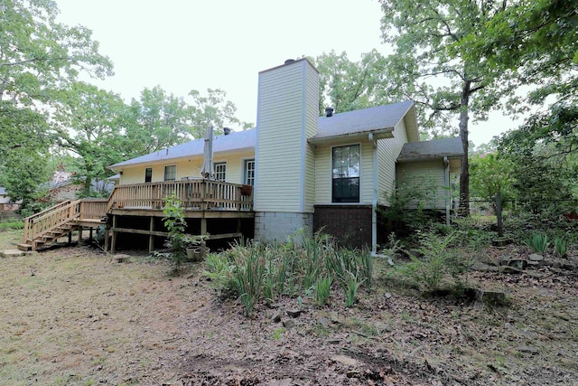 34 Ridge Rd, Cabot, AR 72023 - rear view of house with a wooden deck, a chimney, and stairway