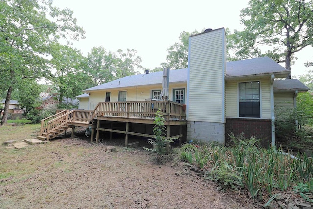 34 Ridge Rd, Cabot, AR 72023 - back of house featuring a chimney, a deck, and stairs