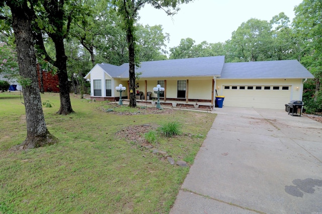 34 Ridge Rd, Cabot, AR 72023 - ranch-style house featuring a garage, a front lawn, concrete driveway, and a porch
