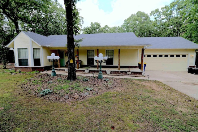 34 Ridge Rd, Cabot, AR 72023 - single story home featuring covered porch, a garage, concrete driveway, and a front yard