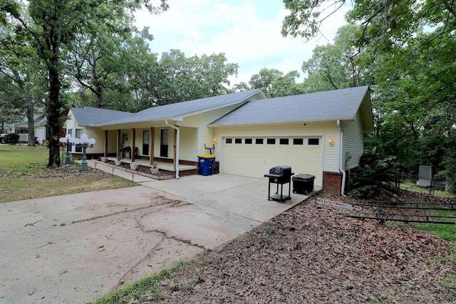 34 Ridge Rd, Cabot, AR 72023 - ranch-style home featuring covered porch, an attached garage, and driveway