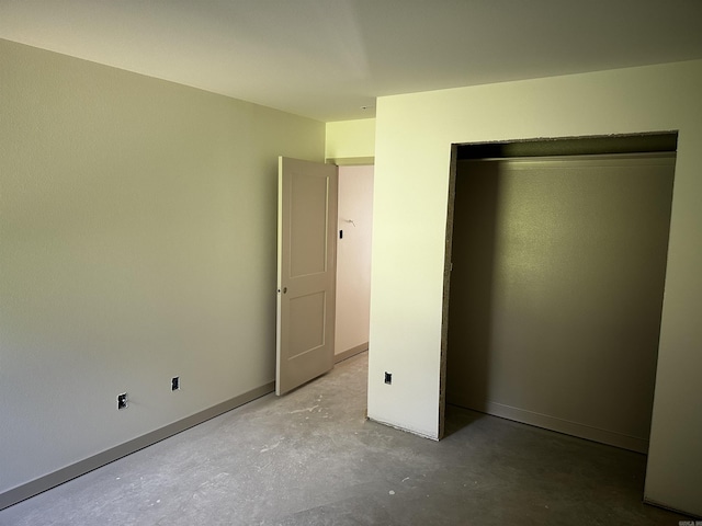 410 N Cedar St, Beebe, AR 72012 - unfurnished bedroom featuring unfinished concrete flooring and a closet