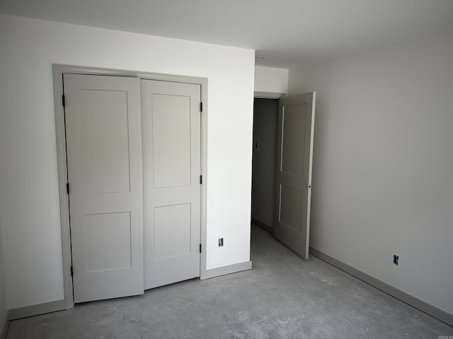 410 N Cedar St, Beebe, AR 72012 - unfurnished bedroom featuring concrete flooring and a closet