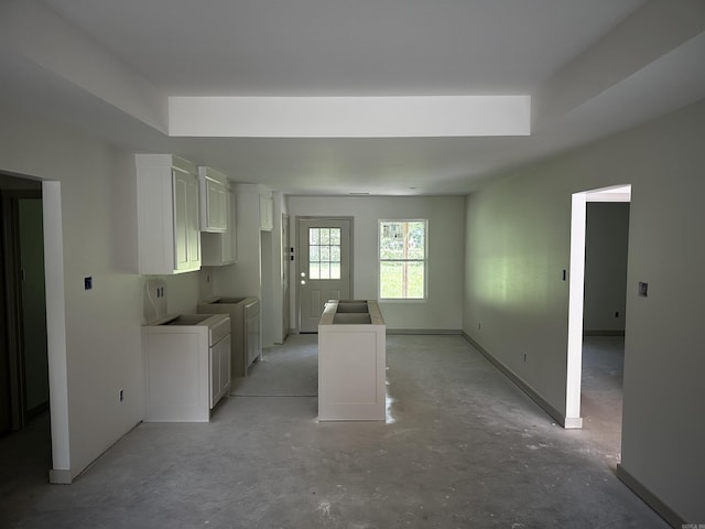 410 N Cedar St, Beebe, AR 72012 - kitchen featuring white cabinetry and concrete floors