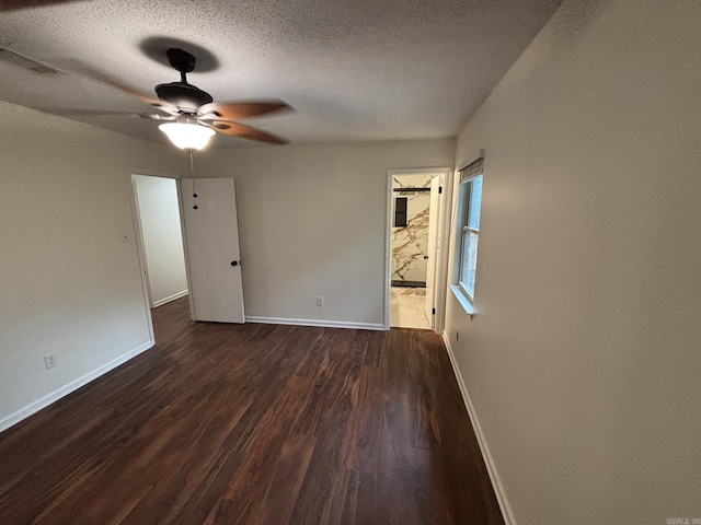 11220 Bainbridge Dr, Little Rock, AR 72212 - unfurnished room featuring a ceiling fan, dark wood finished floors, and a textured ceiling